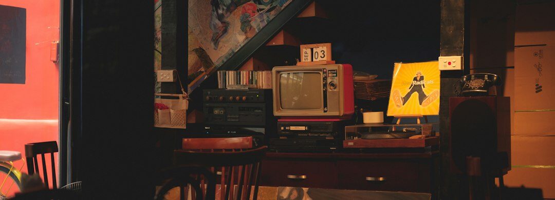 Vintage television production studio with camera and stage lighting